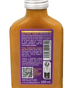 Bouteille de sauce piquante avec étiquette détaillant ingrédients, valeurs nutritionnelles et code QR pour recettes.